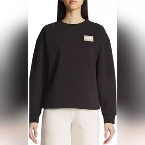 PUMA Women's Fleece Crewneck Sweatshirt Badge. Black. XXL